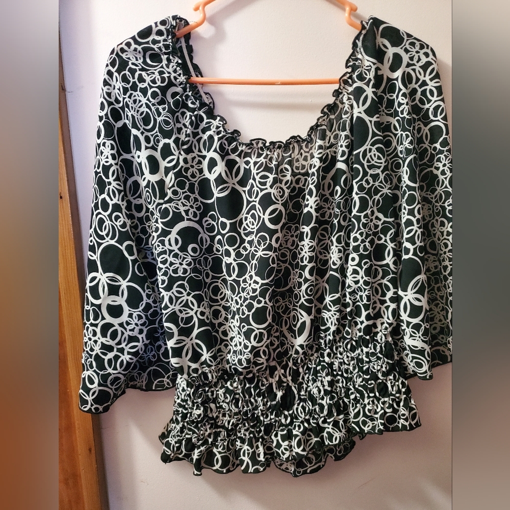 This very pretty blouse and it is a large.